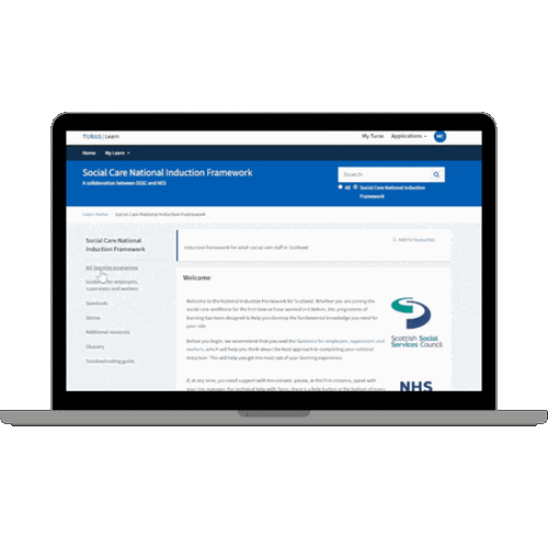 Laptop screen showing the Social Care National Induction Framework homepage on Turas Learn.