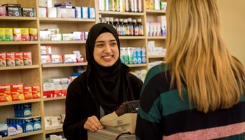 Person smiling towards another person image